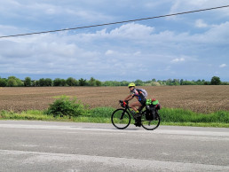 Woman riding a bicycle on a country road