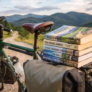 Books stacked on the back of a bicycle