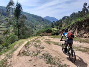 A cyclist exploring the rugged and picturesque trails of Rwanda’s countryside