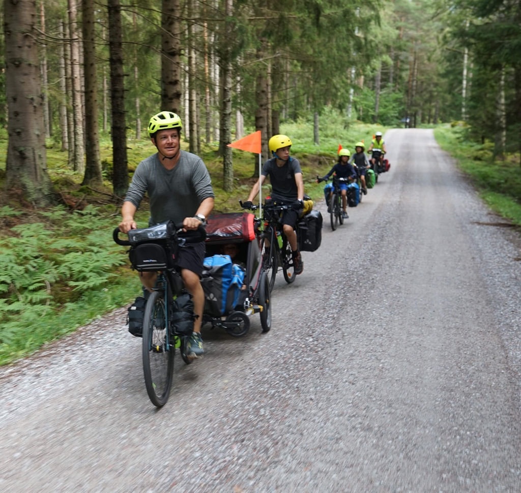 A group of cyclists in a forest